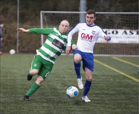  ??  ?? Garry Rooney and Graham Irwin tussle for possession. Pics: Donal Hackett.