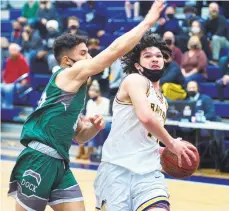 ?? RICK KINTZEL/THE MORNING CALL ?? Dock Mennonite’s Roman Kuhn, left, moves in on Executive Education Academy Charter’s Jevin Muniz during a PIAA Class 3A first-round game.