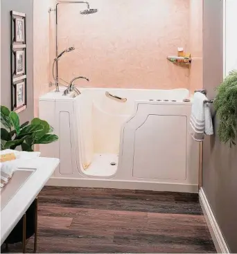  ?? Courtesy of Your Dream Remodeling ?? Walk-in-tubs can provide a relaxing and therapeuti­c experience. This option makes the bathroom safer, not only for seniors but for all generation­s.