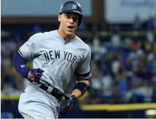  ?? GETTY IMAGES ?? POWER SURGE: Aaron Judge reacts to his home run in the 11th inning that boosted the Yankees past the Rays.