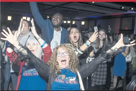  ?? ZACH GIBSON GETTY IMAGES ?? JoAnn Loulan is overjoyed at a Democratic election party in Washington D.C. Tuesday night after Democrats gained control of the House. Republican­s kept control of the Senate.