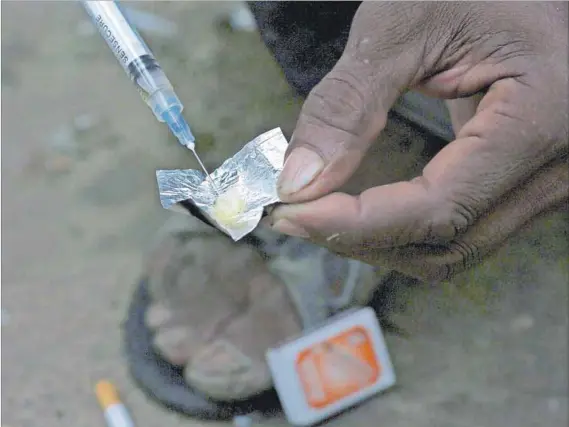  ??  ?? Needless panic: Programmes providing drug users with clean needles reduce their chances of contractin­g HIV, but the eThikweni municipali­ty is threatenin­g to shut down one such project because of needles found on the beach. Photo: Katrina Manson/Reuters