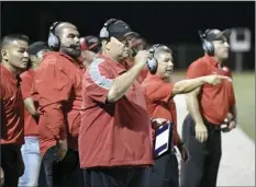  ?? The Maui News / MATTHEW THAYER photo ?? Lahainalun­a coaches, including co-head coach Dean Rickard (foreground), stand on the sideline during a game on Aug. 3.