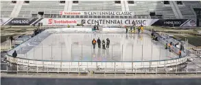  ?? ERNEST DOROSZUK / POSTMEDIA NEWS ?? Workers prepare the outdoor ice rink for the 2017 NHL Centennial Classic at BMO Field in Toronto. The Centennial Classic will be held on New Year’s Day.