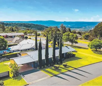  ??  ?? STUNNING OUTLOOK: The unique home at 63 Tourist Rd, Rangeville, is for sale for the first time since it was built in 1956.