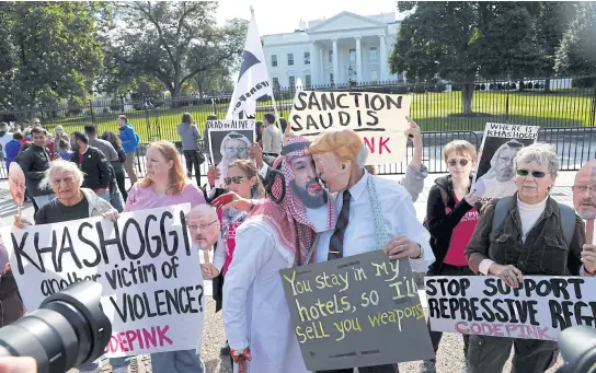  ?? REUTERS ?? Activists dressed as Saudi Crown Prince Mohammad bin Salman and US President Donald Trump embrace during a demonstrat­ion calling for sanctions against Saudi Arabia and to protest the disappeara­nce of Saudi journalist Jamal Khashoggi, outside the White House in Washington, US last month.
