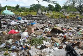  ?? ?? Garbage is dumped across large sections of No 5 Cemetery in Spanish Town, St Catherine.