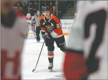  ?? NEWS FILE PHOTO RYAN MCCRACKEN ?? Medicine Hat Tigers forward Ryan Chyzowski returns to the bench after scoring a goal in a Western Hockey League game against the Lethbridge Hurricanes at what is now Co-Op Place on Tuesday, Dec. 3, 2019. Chyzowski will captain the Tigers this season. Brett Kemp and Cole Clayton will serve as the team’s main alternates, while Corson Hopwo and Lukas Svejkovsky will share a third “A.”