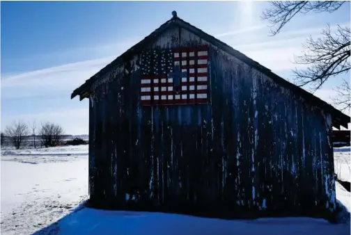  ?? Tribune News Service ?? An American flag is painted on a barn in Emmetsburg, I owa.