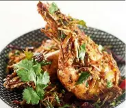  ??  ?? Huge, perfectly cooked prawns underscore the subtle charm of chef Siva’s simple dish.