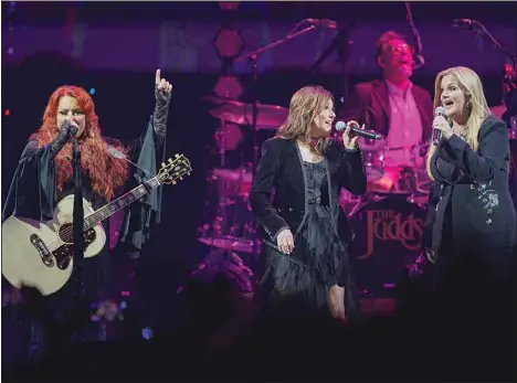  ?? (AP) ?? Wynonna Judd, (left), performs with Martina McBride and Trisha Yearwood, (right), on Friday, Oct. 28, in Nashville, Tenn. Judd is performing with other artists during her tour titled ‘The Judds: The Final Tour.’