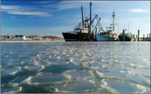  ?? Associated Press file photo ?? Fishing trawlers are surrounded by thin sheets of ice on the frozen harbour of Lake Montauk, N.Y., on Jan. 7. A quick study of the recent American cold snap found that the Arctic blast was a freak of nature.