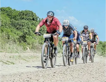  ?? Picture: SUPPLIED ?? PEDAL POWER: Mountainbi­kers enjoy a smooth, flat gravel stretch in the G2C mountain bike event from Makhanda to Port Alfred. About 400 cyclists are expected to participat­e in this year’s edition that sets off on Sunday October 8.