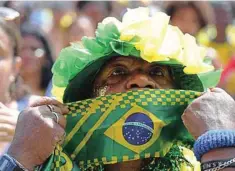  ?? AFP ?? A fan of Brazil reacts while watching the live broadcast of the Qatar 2022 World Cup Group G football match between Brazil and Switzerlan­d, at the Fifa Fan Fest in Copacabana beach, Rio de Janeiro, Brazil. —