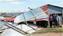  ?? ?? ROOF BLOWN OFF: The Kiti family ran from their house in the middle of the night when the storm ripped the roof off their house.