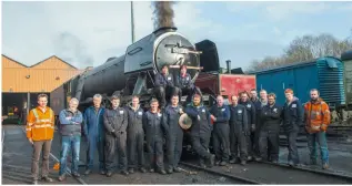  ?? JACK BOSKETT ?? Ian Riley and the team who have overhauled Flying Scotsman gather proudly at Bury shed as the ‘Pacific’ raises steam for its first runs on January 6.