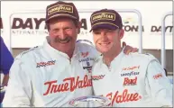  ?? Chris O'Meara / Associated Press ?? Dale Earnhardt, left, hugs Dale Earnhardt Jr. in Victory Lane in 2000 after the elder Earnhardt won the Internatio­nal Race of Champions round at the Daytona Internatio­nal Speedway in Daytona Beach, Fla.