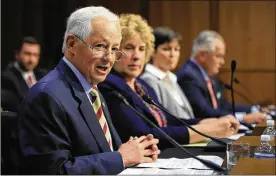  ?? MANUEL BALCE CENETA / AP ?? Washington state Insurance Commission­er Mike Kreidler and Alaska Division of Insurance Director Lori Wing-Heier join other officials testifying Wednesday during a Senate Health, Education, Labor & Pensions Committee hearing.