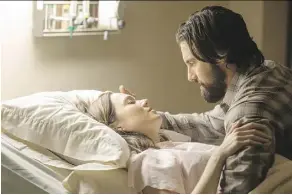 ?? NBC ?? NBC’s new hit show This Is Us stars Mandy Moore as Rebecca and Milo Ventimigli­a as Jack, a couple raising three kids in the 1980s.