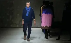  ?? Photograph: Scott A Garfitt/Invision/AP ?? Dries Van Noten accepts applause for his auutmn/winter 2024-25 ready-to-wear collection in Paris last month.