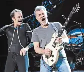  ?? GREG ALLEN/INVISION 2015 ?? Eddie Van Halen, right, performs with David Lee Roth. Van Halen died Tuesday at 65 after a bout with cancer.