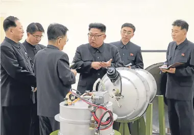  ?? AP. Picture: ?? An image distribute­d by the North Korean government, showing North Korean leader Kim Jong-un at an undisclose­d location. It said he inspected the loading of a hydrogen bomb into a new interconti­nental ballistic missile.