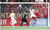  ?? Reuters ?? Atlanta United’s Josef Martinez scores a goal against DC United goalkeeper David Ousted. —