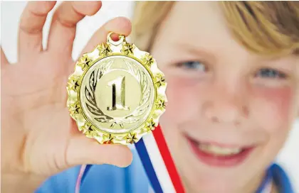  ??  ?? A sporting medal has more allure to a 9-year-old than any “treasure” gathered from the ground while wandering.