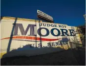  ?? (Carlo Allegri/Reuters) ?? A BANNER promoting Republican Senatorial candidate Roy Moore is seen on the side of a building in Birmingham on Saturday.