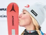  ?? MARCO BERTORELLO/GETTY-AFP ?? Mikaela Shiffrin celebrates after breaking a tie with former U.S. teammate Lindsey Vonn for the most World Cup race wins by a female skier.