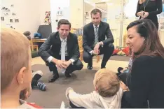  ??  ?? Simon Birmingham and Human Services Minister Michael Keenan (right) during a visit to the Acacia Children's Centre in Canberra.