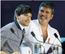  ??  ?? JUDGE LOUIS With Simon Cowell on The X Factor’s judging panel in 2018