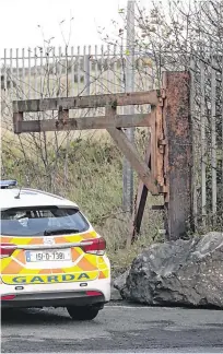  ??  ?? Hunt: Garda activity at an area on Cement Road, Drogheda, included searches using a digger