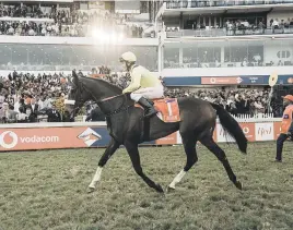  ?? Picture: AFP ?? BYGONE DAYS. Jockey Richard Fourie and Do It Again won last year’s Vodacom Durban July horse race.