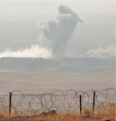  ?? — GETTY IMAGES ?? Smoke billows from the Iraqi city of Nineveh during an operation against ISIL on Monday. Thousands of Kurdish peshmerga forces advanced on jihadist-held villages east of Mosul.