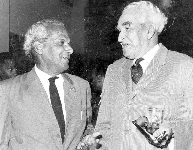  ?? GLEANER ARCHIVES ?? In this 1969 photo, two famous cousins and national heroes, Sir Alexander Bustamante (right) and Norman Manley, greet each other at the Jamaica Broadcasti­ng Corporatio­n’s building in Kingston.