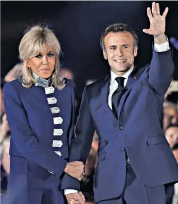  ?? ?? Emmanuel Macron and his wife, Brigitte, prepare to move back into the Elysee Palace after winning the trust of the French electorate