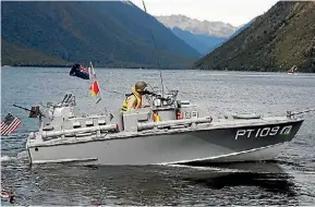  ?? MARTIN DE RUYTER/ THE LEADER ?? Michael Sharratt of Christchur­ch with his 4.5 to 1 scale replica of PT 109 in the water at the New Zealand Antique and Classic Boat Show.