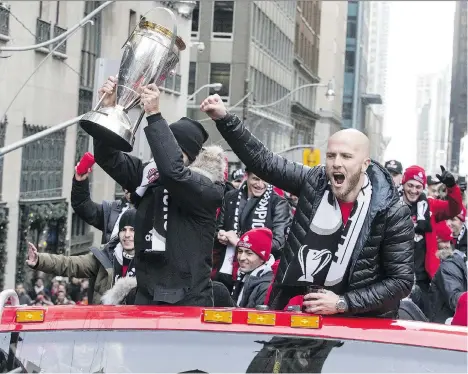  ?? CRAIG ROBERTSON ?? Toronto FC captain Michael Bradley pumps his fist during the Dec. 11 parade to celebrate his team’s victory over the Seattle Sounders in the MLS Cup final Dec. 9. TFC kicks off the 2018 season March 3 against Columbus Crew SC in a rematch of this...