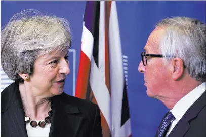  ?? Virginia Mayo ?? The Associated Press British Prime Minister Theresa May meets with European Commission President Jean-claude Juncker on Wednesday at EU headquarte­rs in Brussels in a bid to finalize a Brexit agreement.