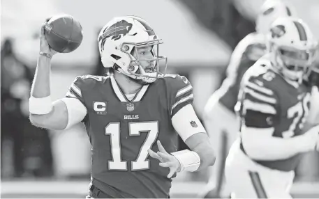  ?? RICH BARNES/USA TODAY SPORTS ?? Bills quarterbac­k Josh Allen threw for 324 yards and two TD passes and ran for 54 yards and a TD in the wild-card victory against the Colts.