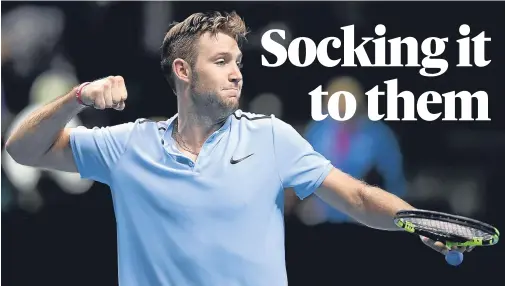  ??  ?? PACKING PUNCH: Jack Sock celebrates victory against Wimbledon finalist Marin Cilic in the ATP Finals yesterday