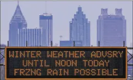  ?? JOHN SPINK / JSPINK@AJC.COM ?? A GDOT sign advises incoming motorists on northbound I-85 from the airport of the advisory issued for metro Atlanta on Jan. 8.