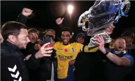  ?? Photograph: Alex Morton/Getty Images ?? Shaun Jeffers celebrates with St Albans fans on the pitch after victory at Clarence Park.