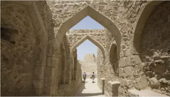  ?? Jaime Puebla / The National ?? Tourists at Qal’at al-Bahrain, an archaeolog­ical site near the capital Manama