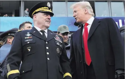  ?? Susan Walsh The Associated Press ?? President Donald Trump talks with Army Chief of Staff Gen. Mark Milley during the Army-Navy game Saturday in Philadelph­ia. Trump announced that Milley is his choice for the next chairman of the Joint Chiefs of Staff.