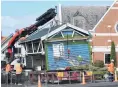  ?? PHOTO: STEPHEN JAQUIERY ?? The Maori Hill bus shelter is lifted from its foundation­s last Wednesday morning.