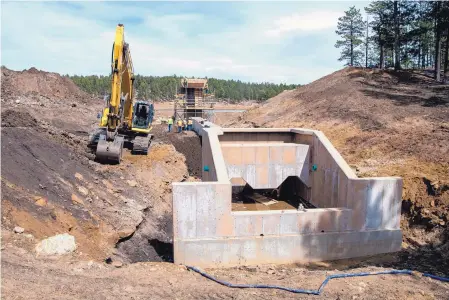  ?? EDDIE MOORE/JOURNAL ?? This is the spillway for the new dam under constructi­on at Morphy Lake. The water level at the lake is currently quite low, but it will fill back up again when the project is complete.