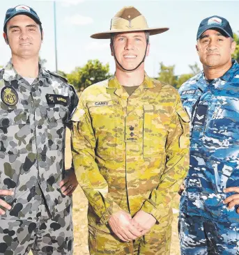  ?? PROUD TRADITION: Naval Petty Officer Michael Baruch, Commanding Officer of TCG- 6 Lieutenant Colonel Peter Carey and RAAF Corporal Alladice Aufai at yesterday’s parade. Picture: ALIX SWEENEY ??