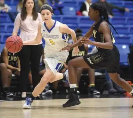  ?? The Sentinel-Record/Mara Kuhn ?? DRIVE THROUGH: Lakeside guard Ashton Patrick (4) drives past Brinkley’s Destiny Cartwright (2) in the first round of the Chartwells Spa City Shootout Wednesday night at Bank of the Ozarks Arena. Patrick scored a game-high 23 points in Lakeside’s 52-20...